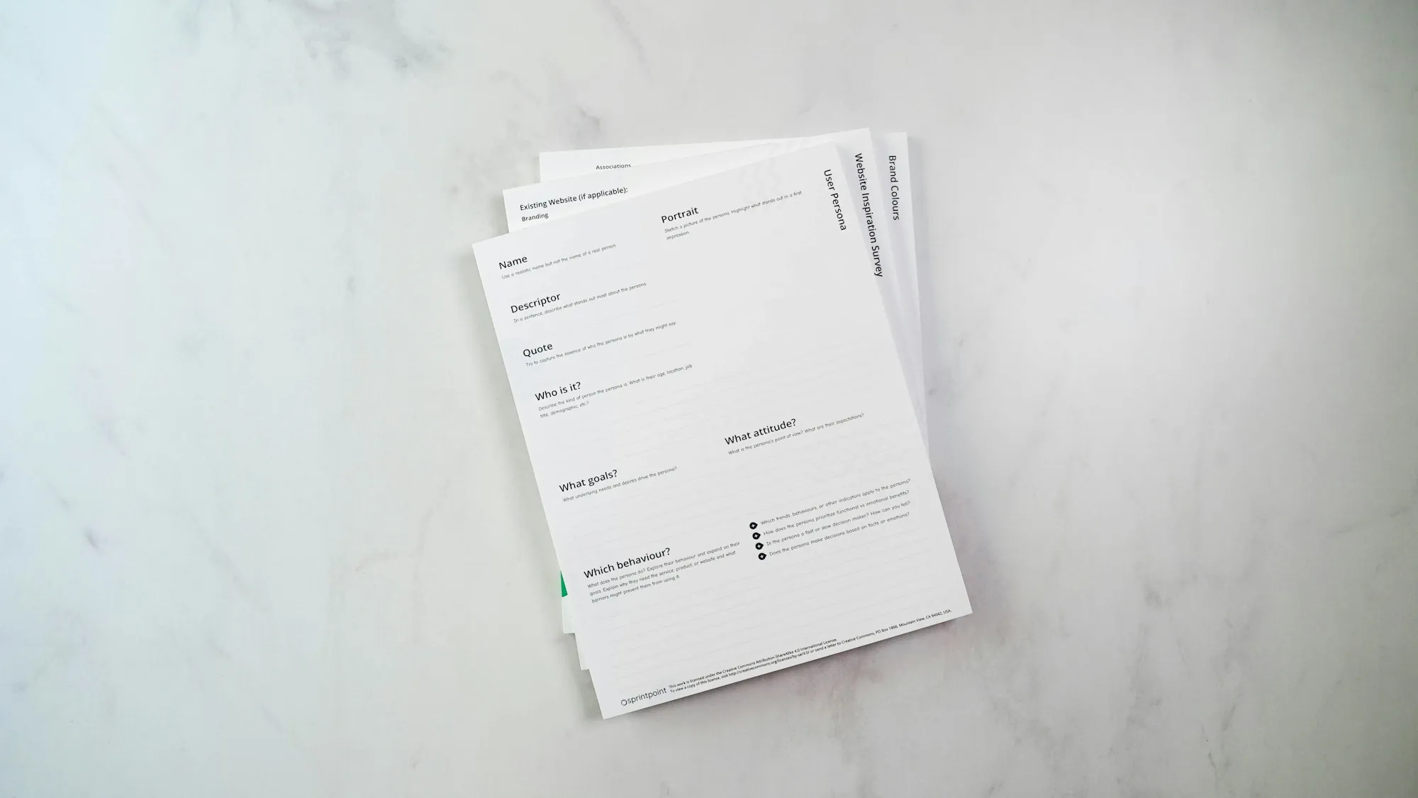 Stack of printed forms on a marble surface